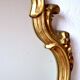 Large rococo mirror in gold painted wood