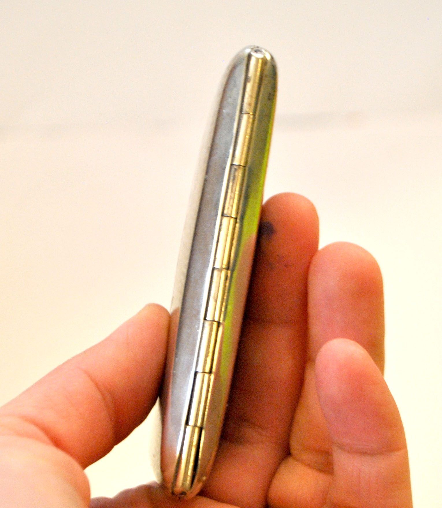 Art Deco cigarette case, alpaca cigarette holder with WS monogram.