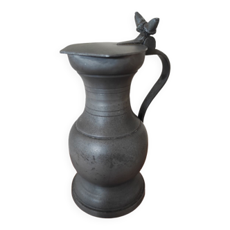 Pewter pitcher with its flip lid