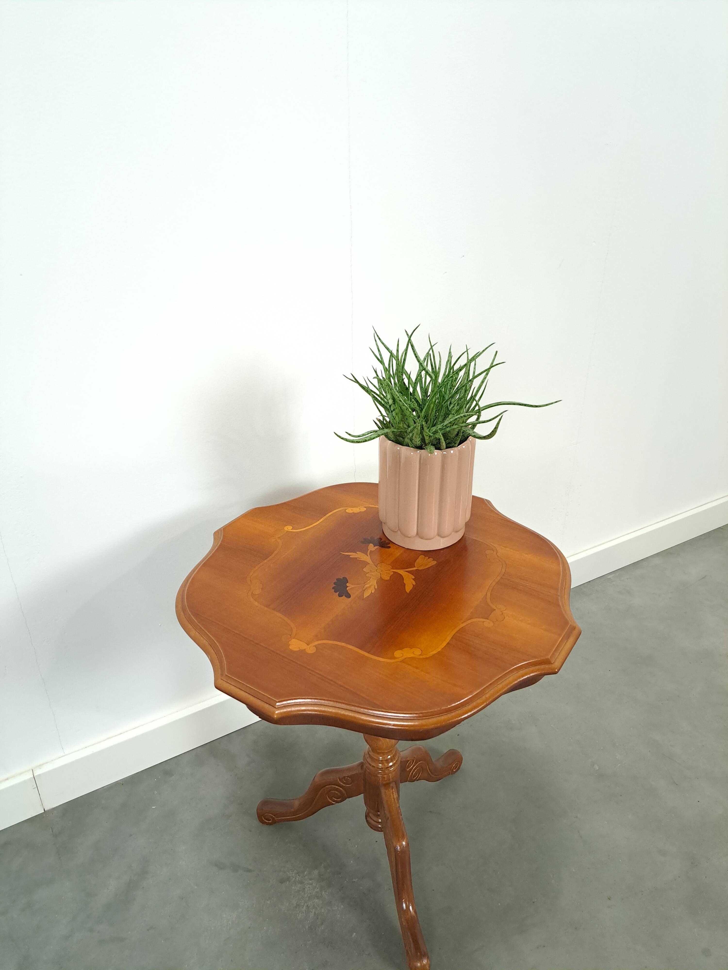 Round vintage wooden side table with inlaid veneer