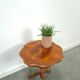 Round vintage wooden side table with inlaid veneer