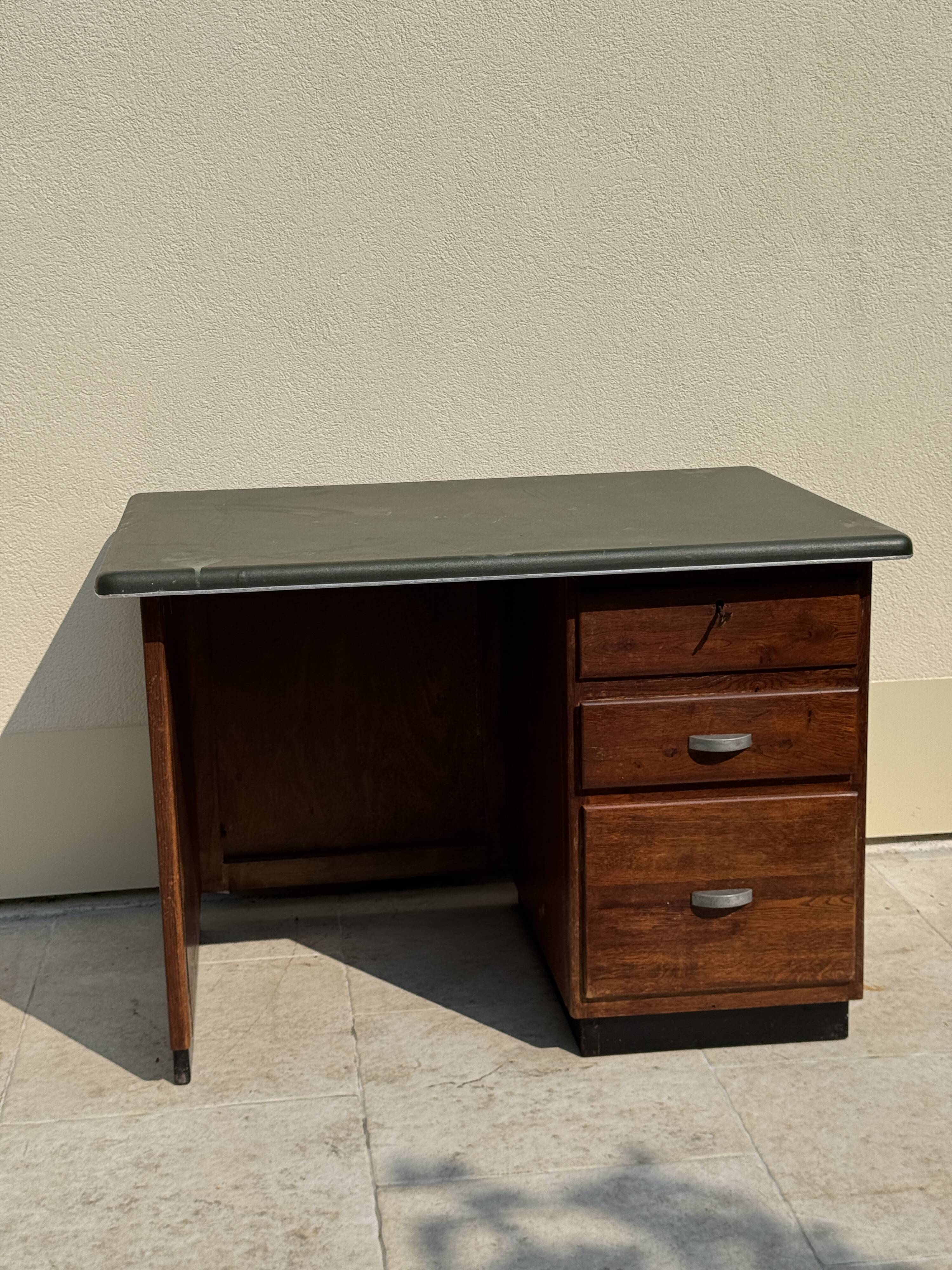 Modernist desk in wood and green moleskin upholstery