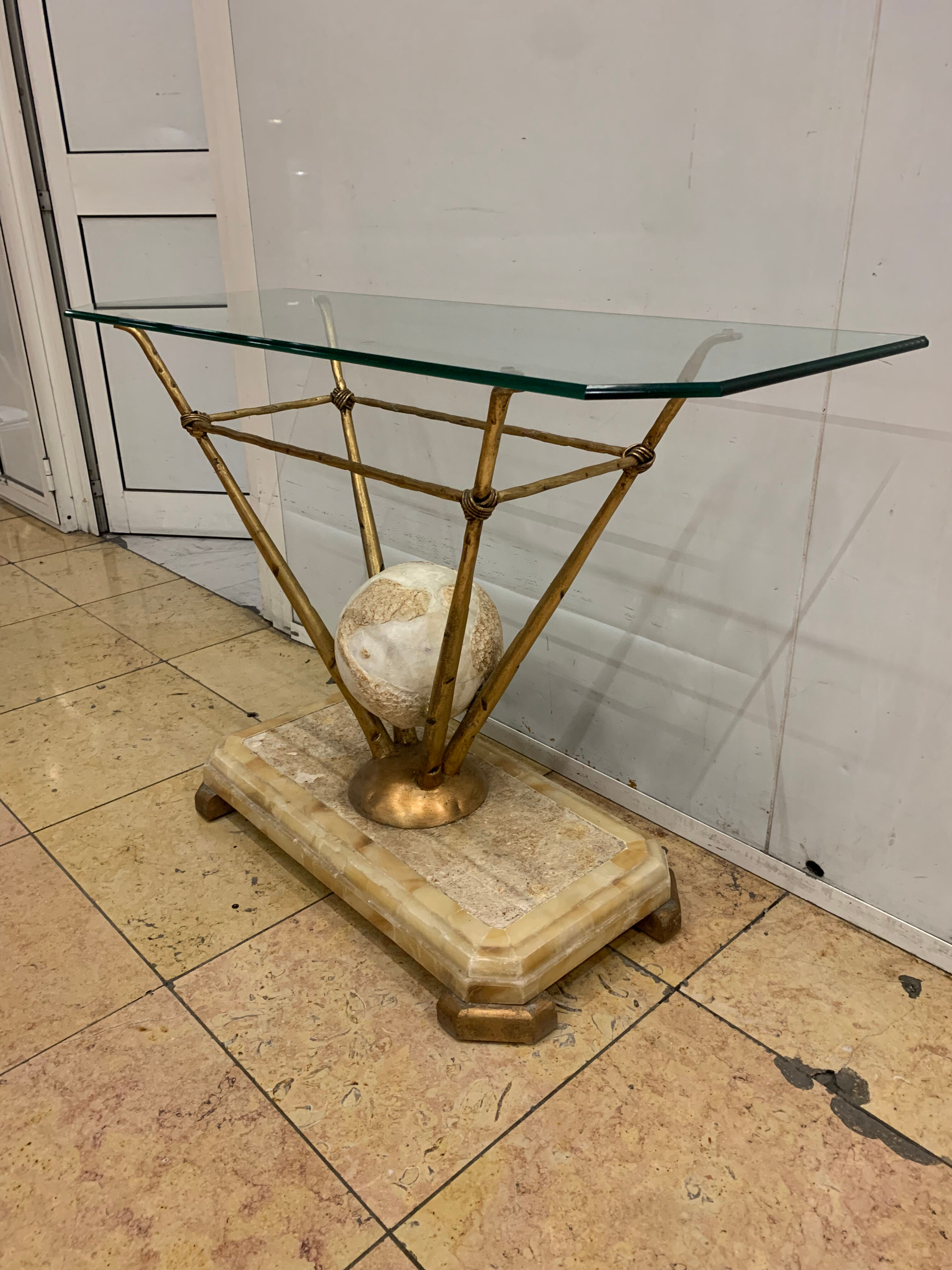 Travertine console from Fournier Paris over glass