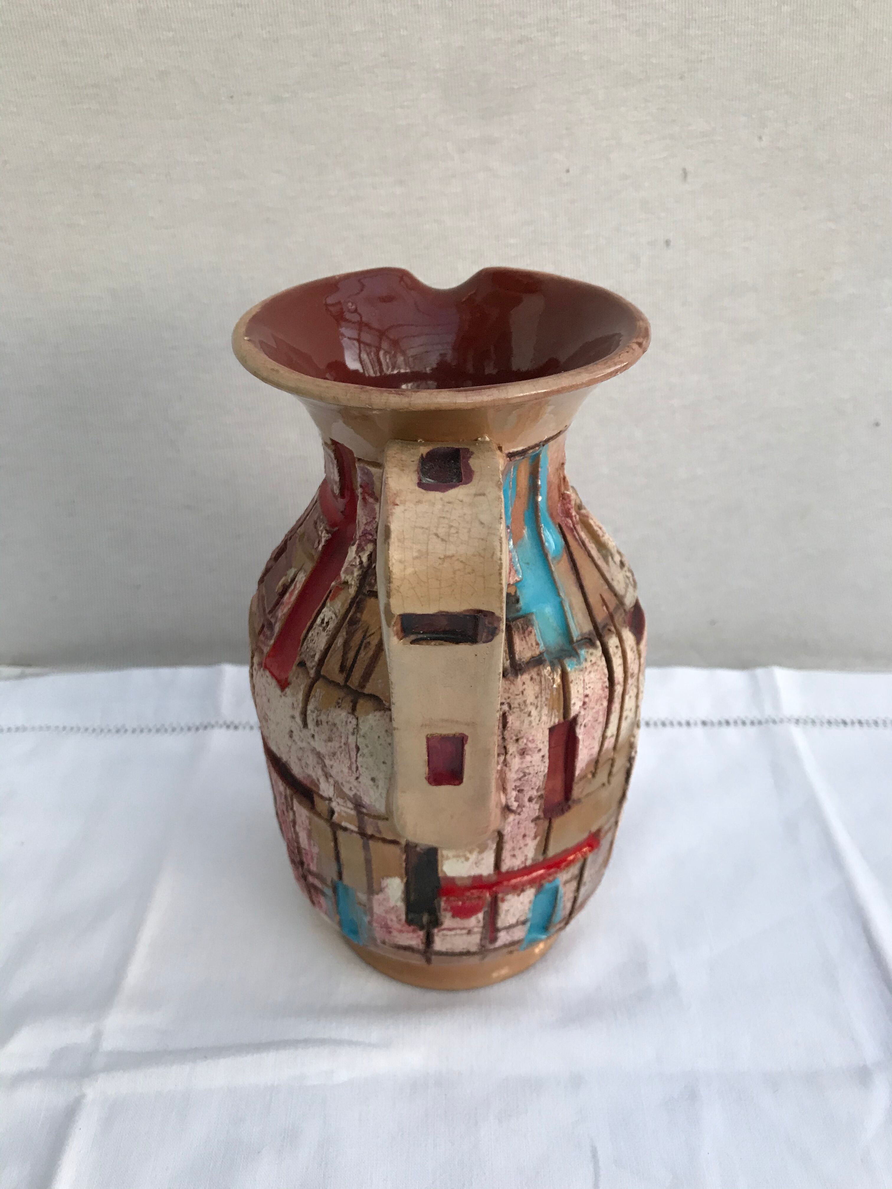 Former beige ceramic pitcher