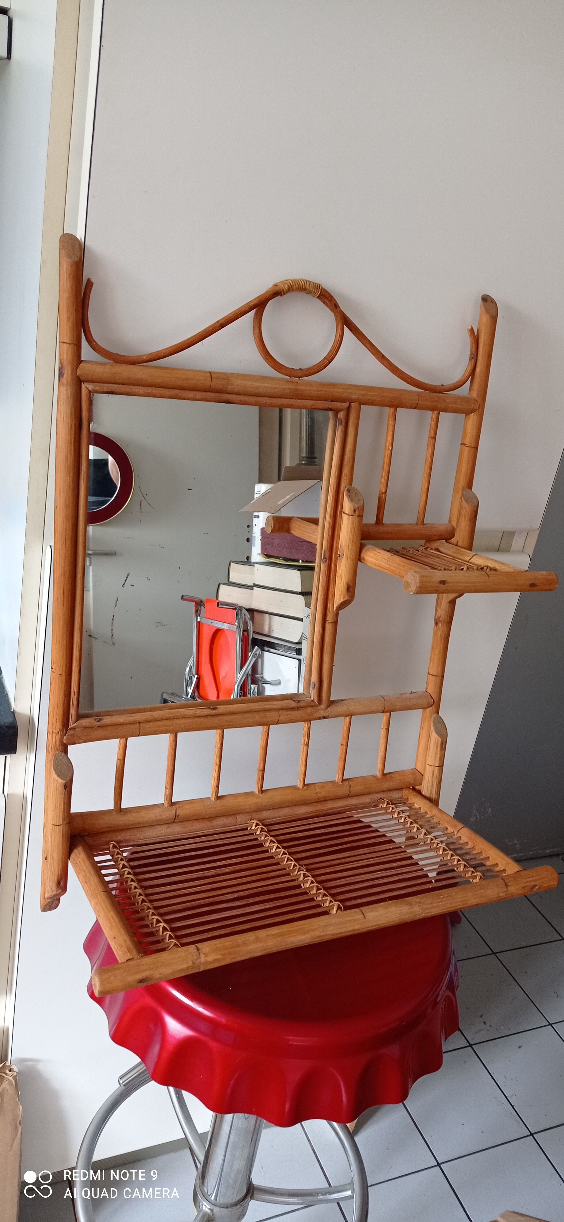 Old bamboo and rattan mirror with vintage folding shelves
