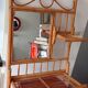Old bamboo and rattan mirror with vintage folding shelves