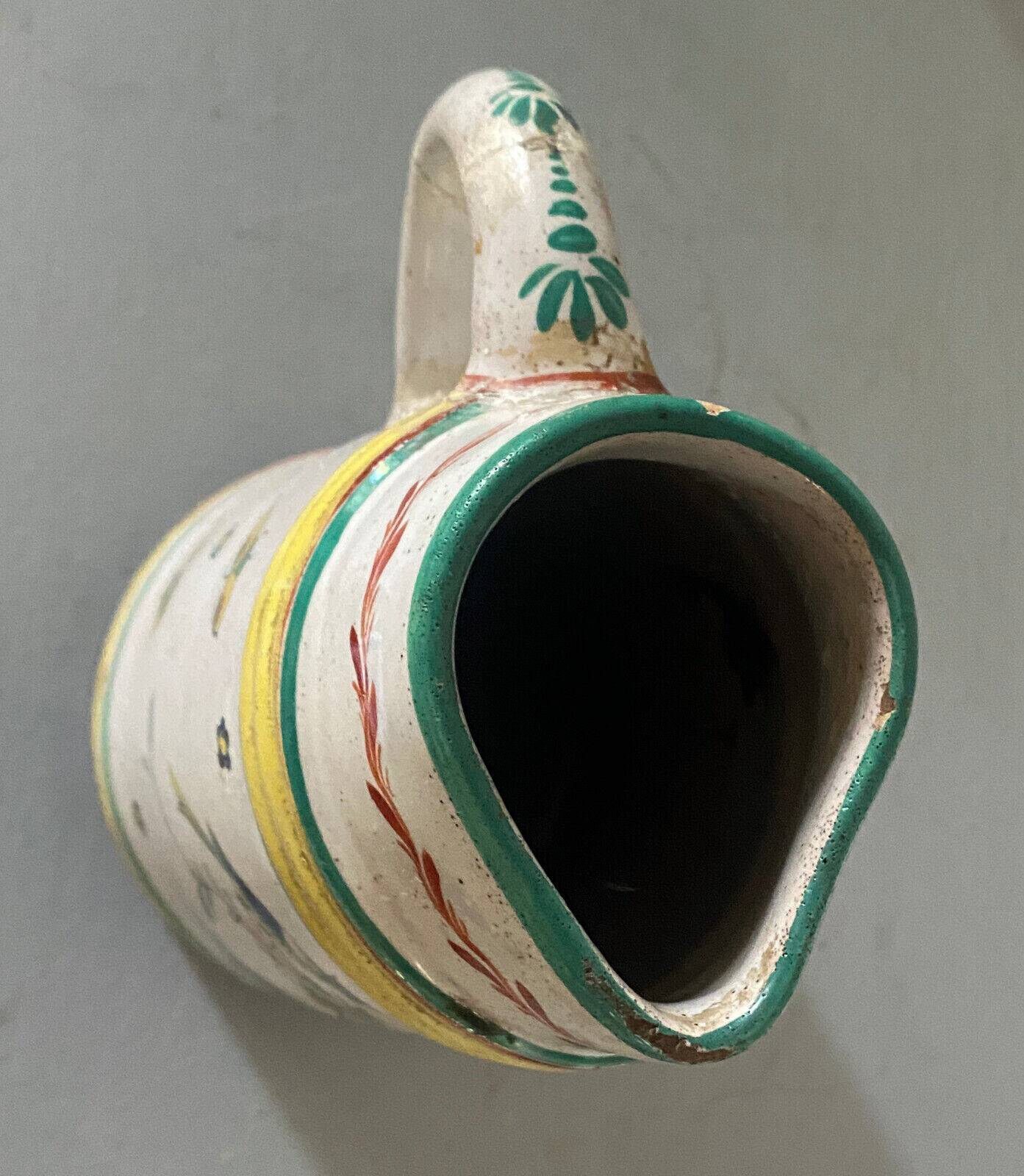 Old ceramic pitcher (18th century?) decorated with polychrome exotic birds