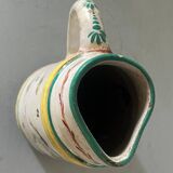 Old ceramic pitcher (18th century?) decorated with polychrome exotic birds