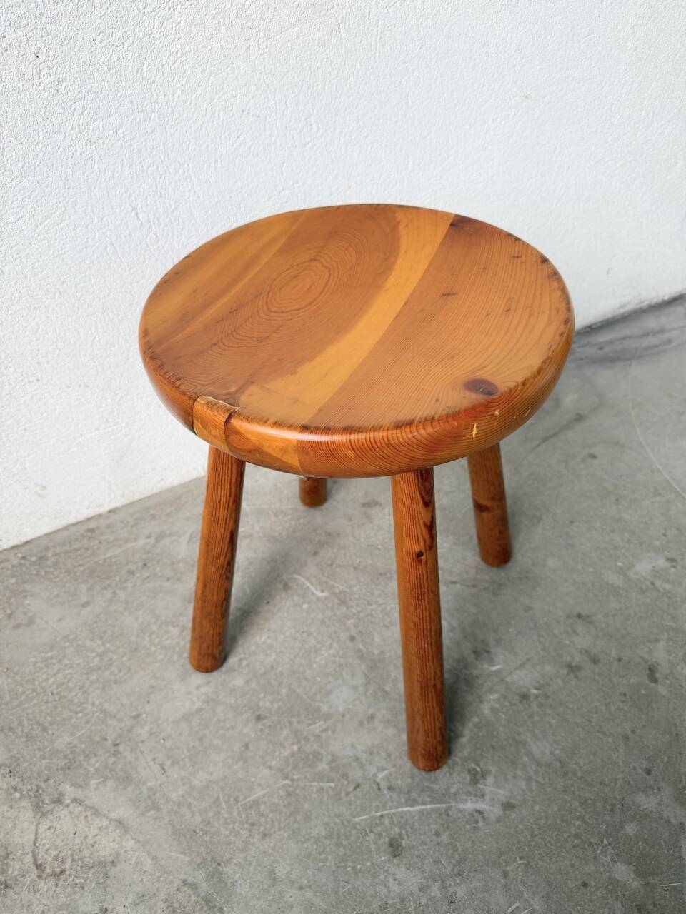 Pine stool assigned to Charlotte Perriand for Les Arcs.