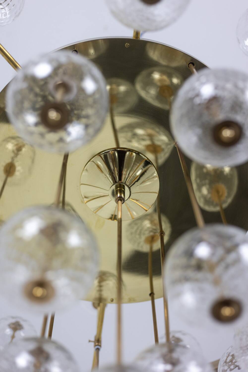 Large chandelier in gilded brass with decorative balls. 1970s.