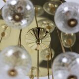 Large chandelier in gilded brass with decorative balls. 1970s.