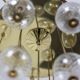 Large chandelier in gilded brass with decorative balls. 1970s.