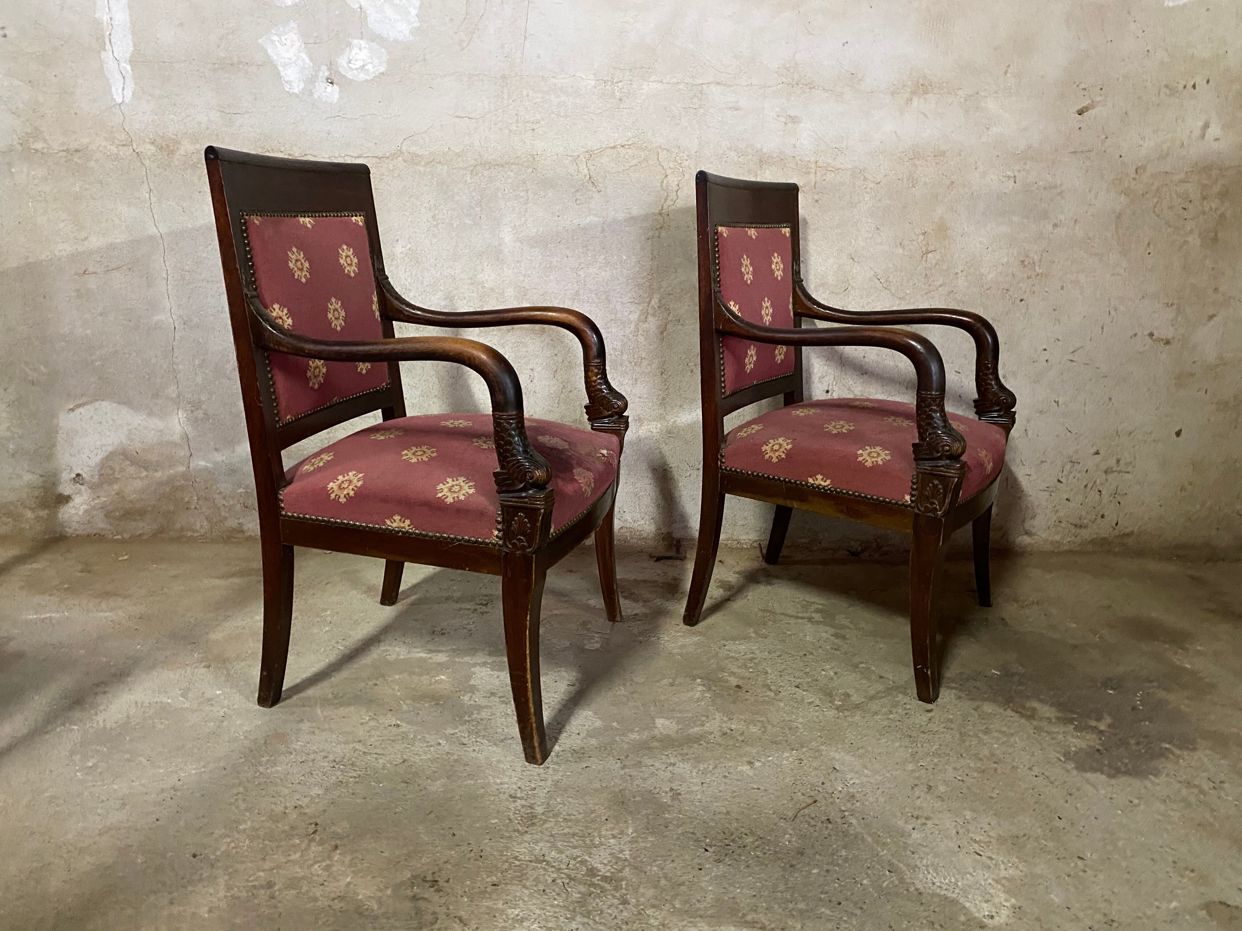 Pair of empire-style armchairs with dolphins