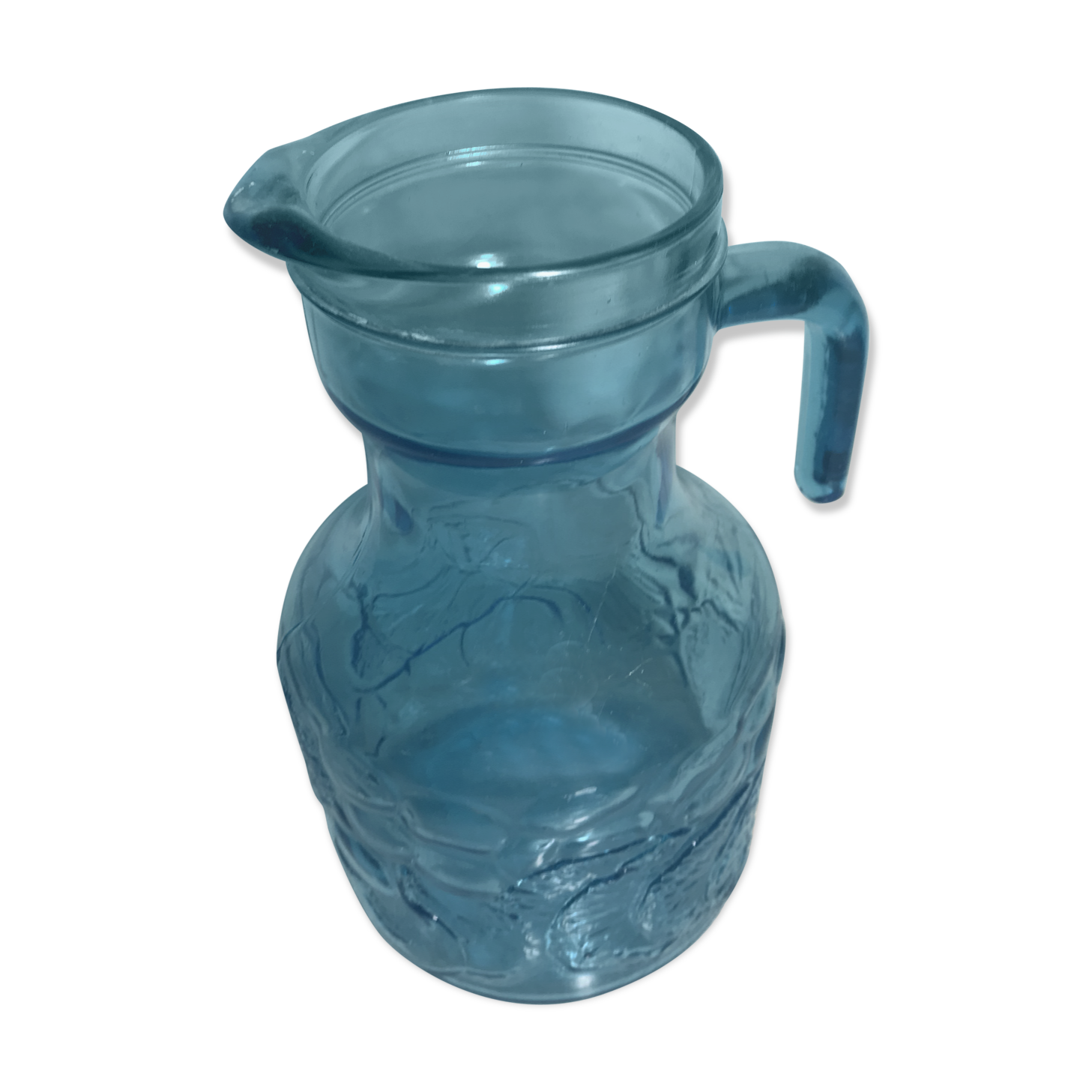 Blue moulded pitcher with decorative handle