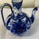 Glazed ceramic carafe with floral decoration