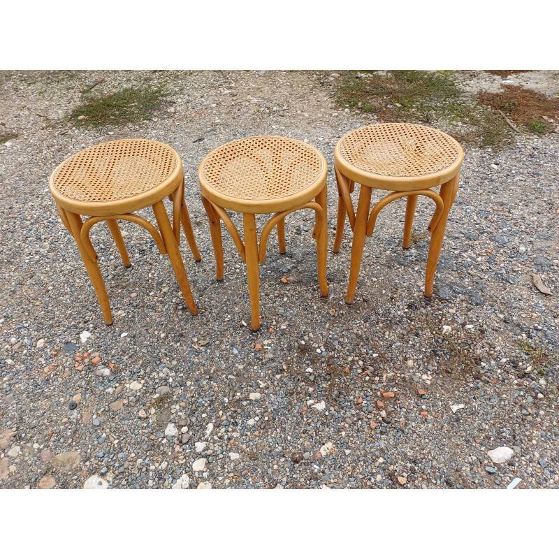 3 wooden and cane stools