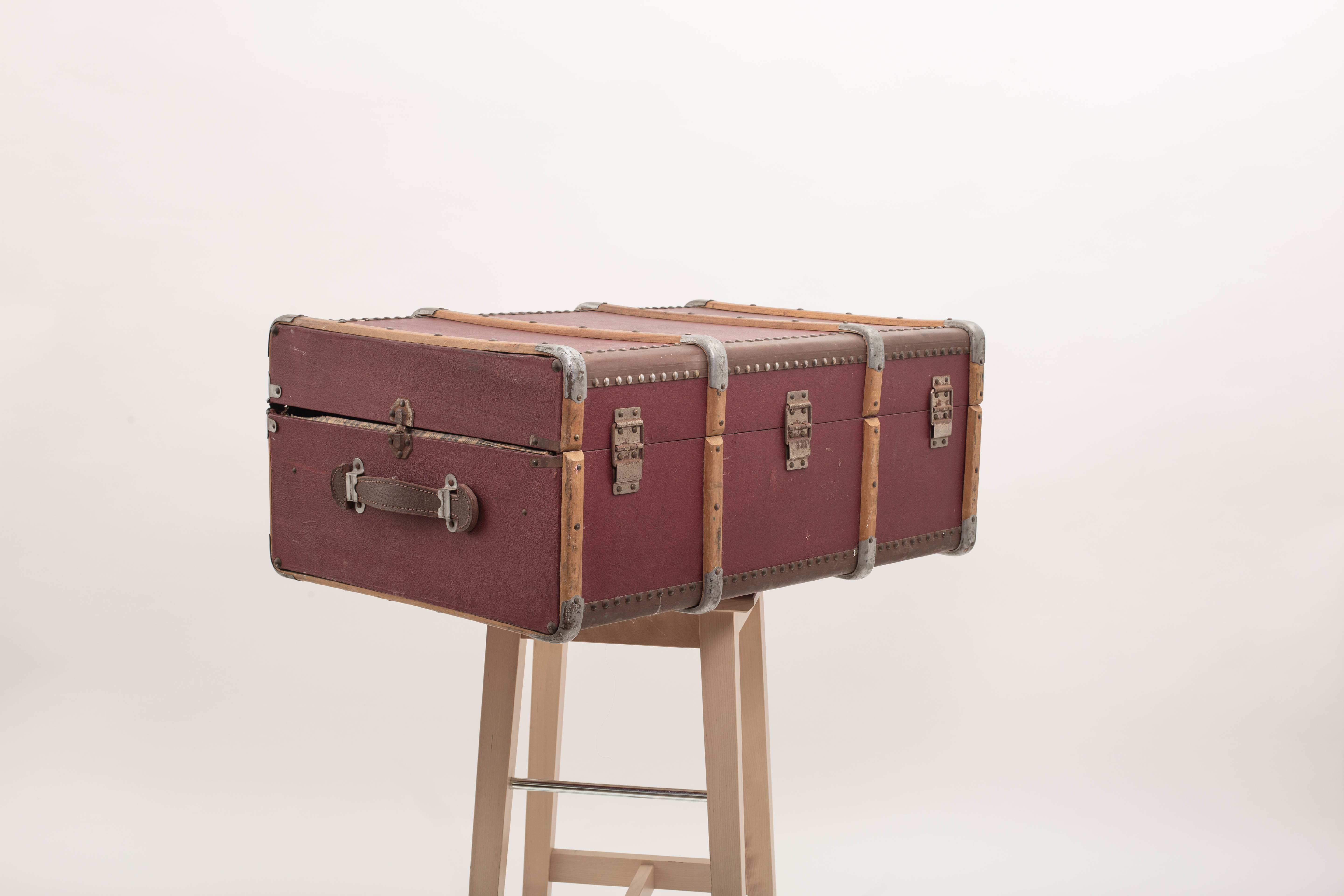Old trunk travel suitcase burgundy color