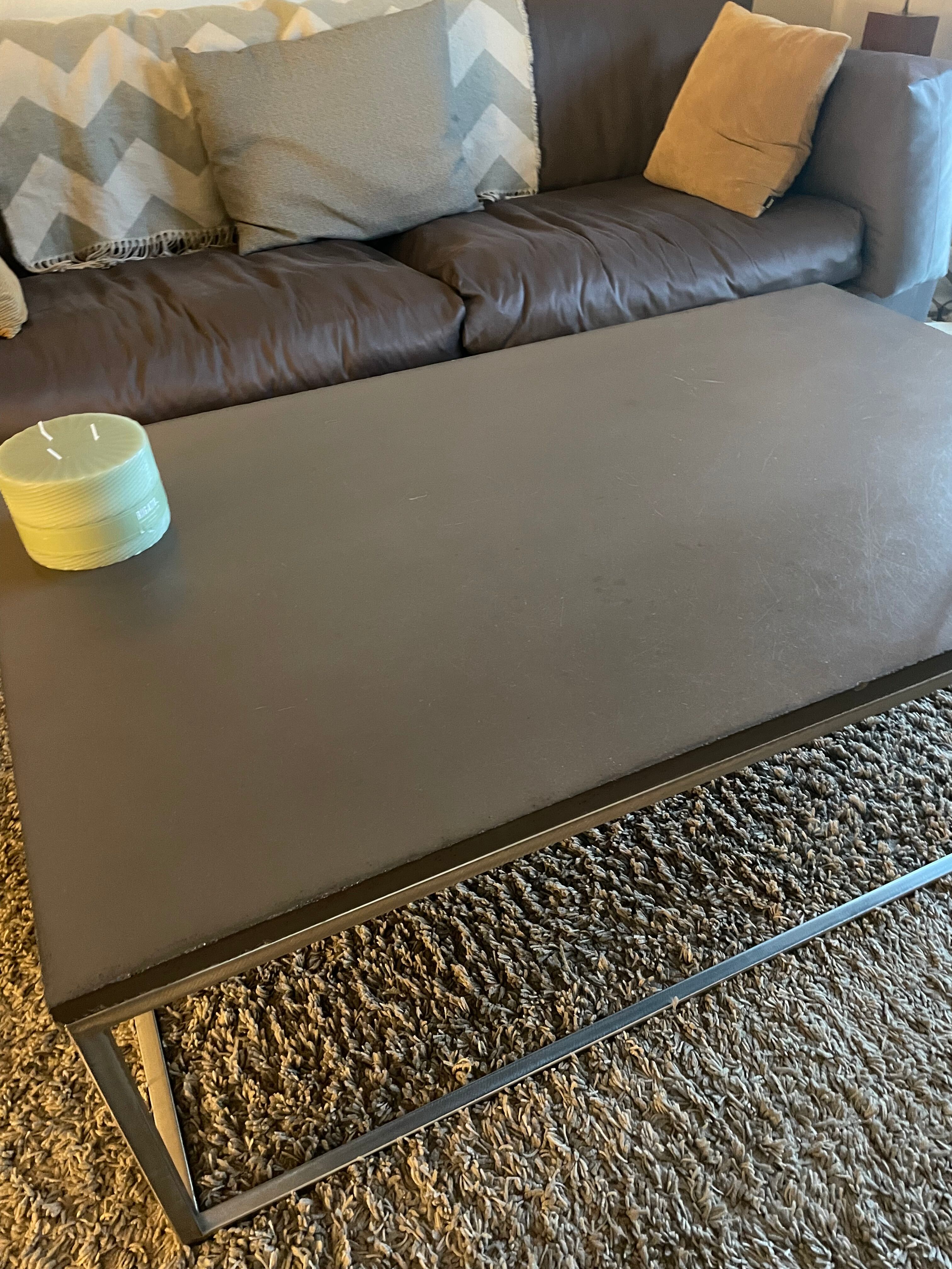 Coffee table in stone and brushed steel