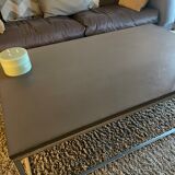 Coffee table in stone and brushed steel