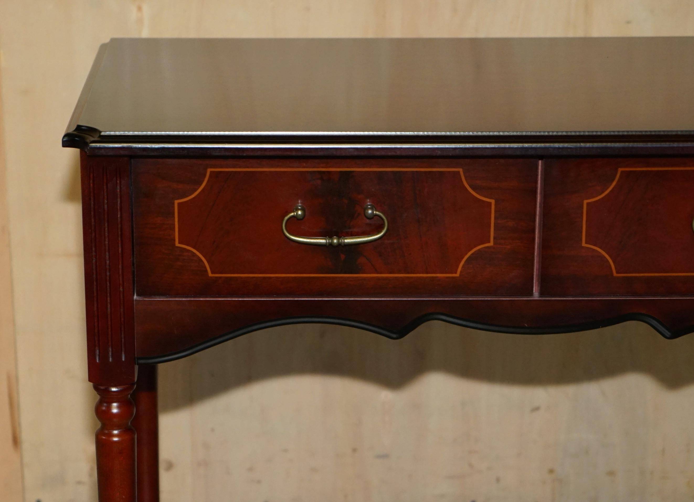 Small console with two drawers in hardwood finish.