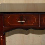 Small console with two drawers in hardwood finish.