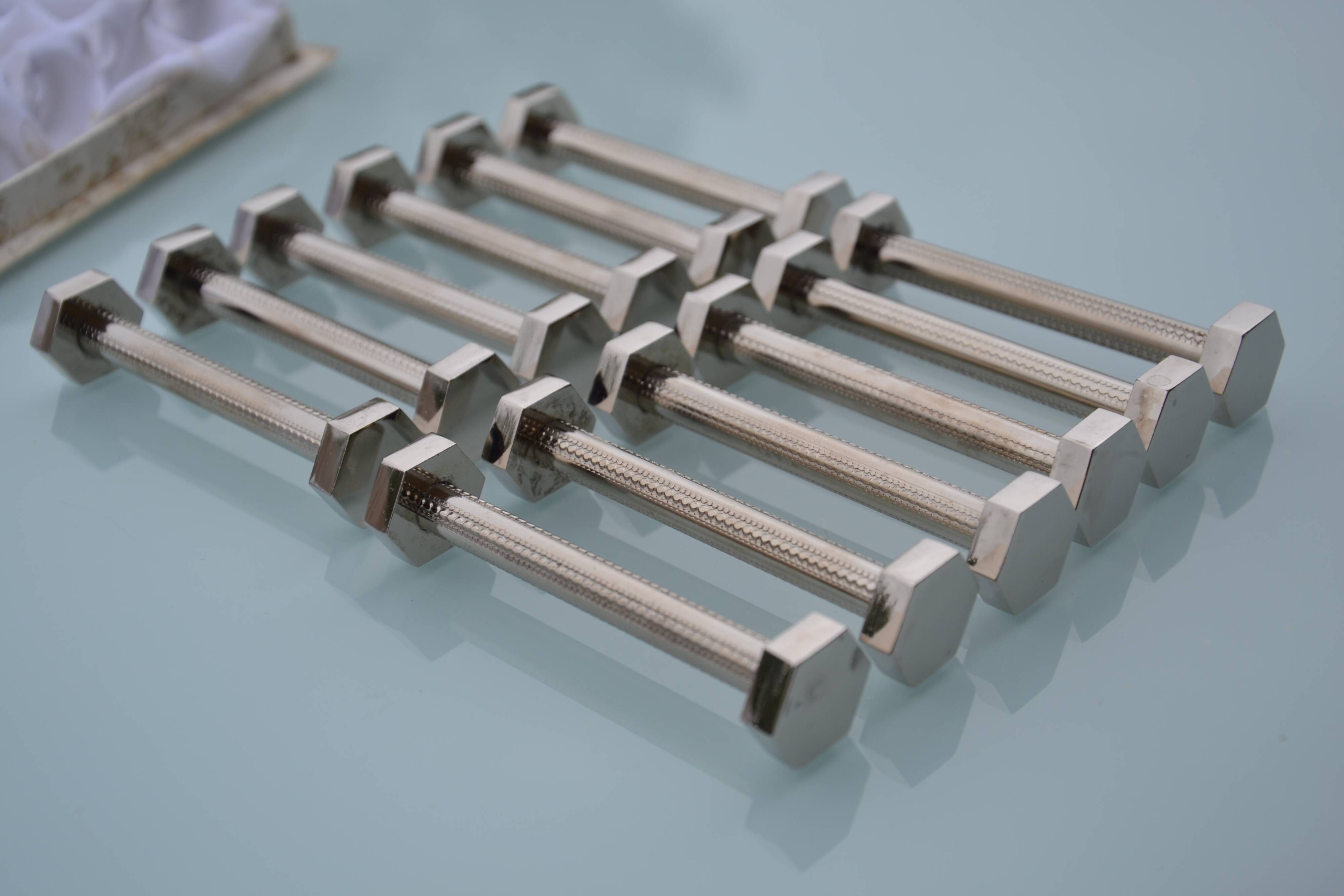 12 bolt-shaped knife rests in their original vintage box
