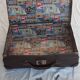 Small old suitcase with a ribbed appearance