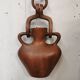 Vase with carved wooden handles