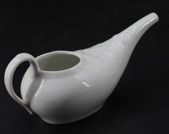 Old white earthenware sausage