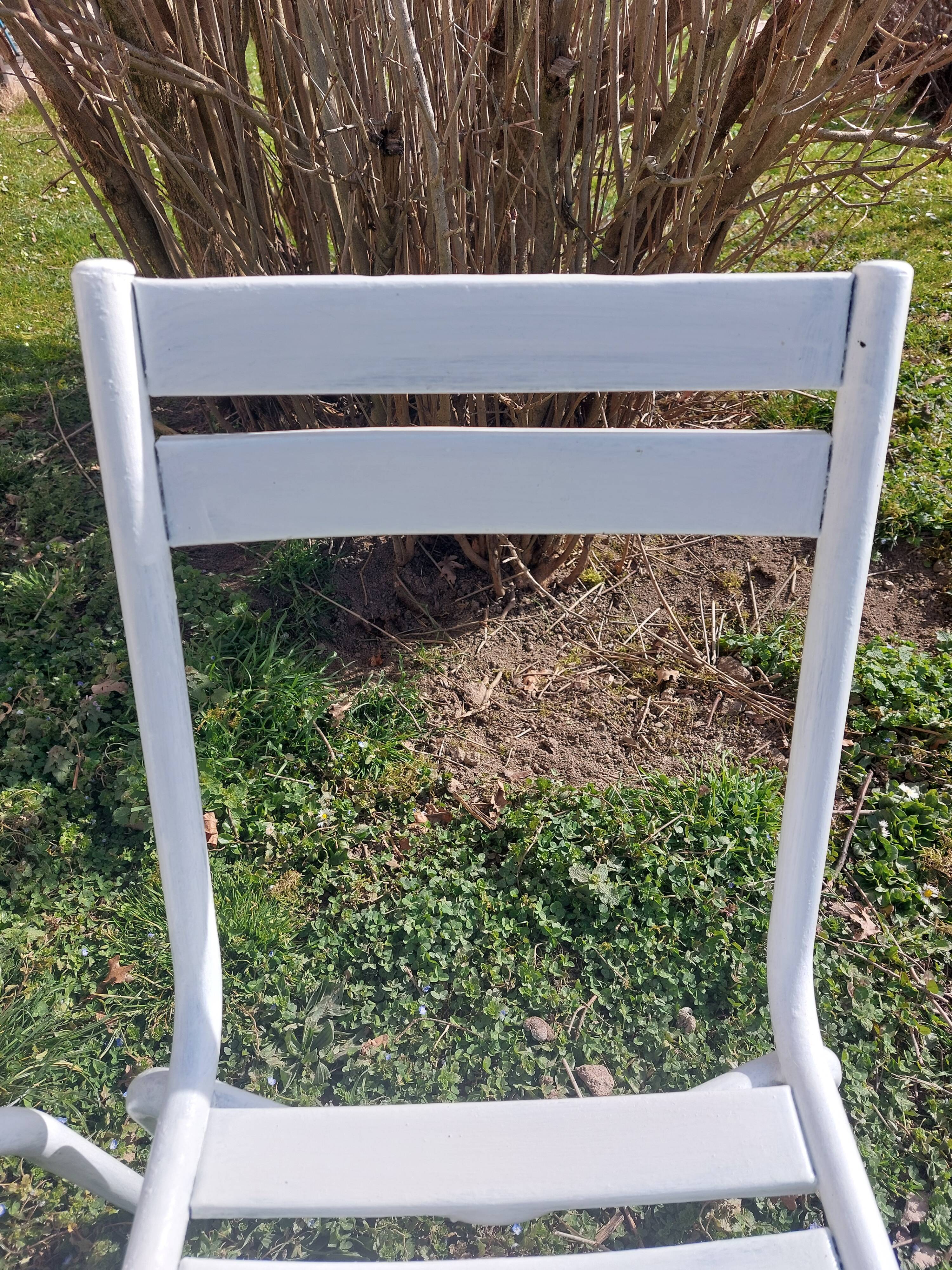 pair of white metal chairs, Tolix style