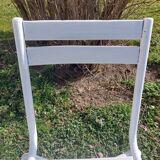 pair of white metal chairs, Tolix style