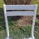 pair of white metal chairs, Tolix style