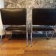 Pair of chrome and faux leather armchairs