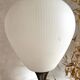 Vintage reed floor lamp in black metal and brass with three white opalines