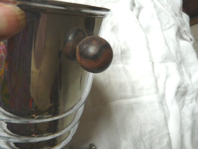 Ice in chromed metal and macassar ebony and pliers bucket