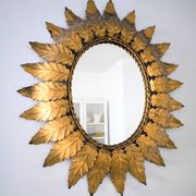 Miroir «Sun Mirror» espagnol des années 60, en métal doré.