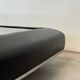 Vintage coffee table covered in leather, smoked mirror top and chrome legs.
