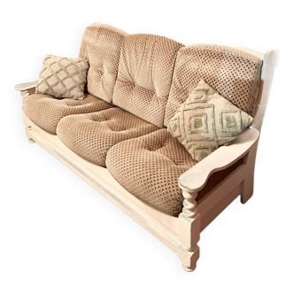 Vintage sofa in wood and fabrics.