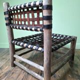 Vintage armchair in woven leather and wood