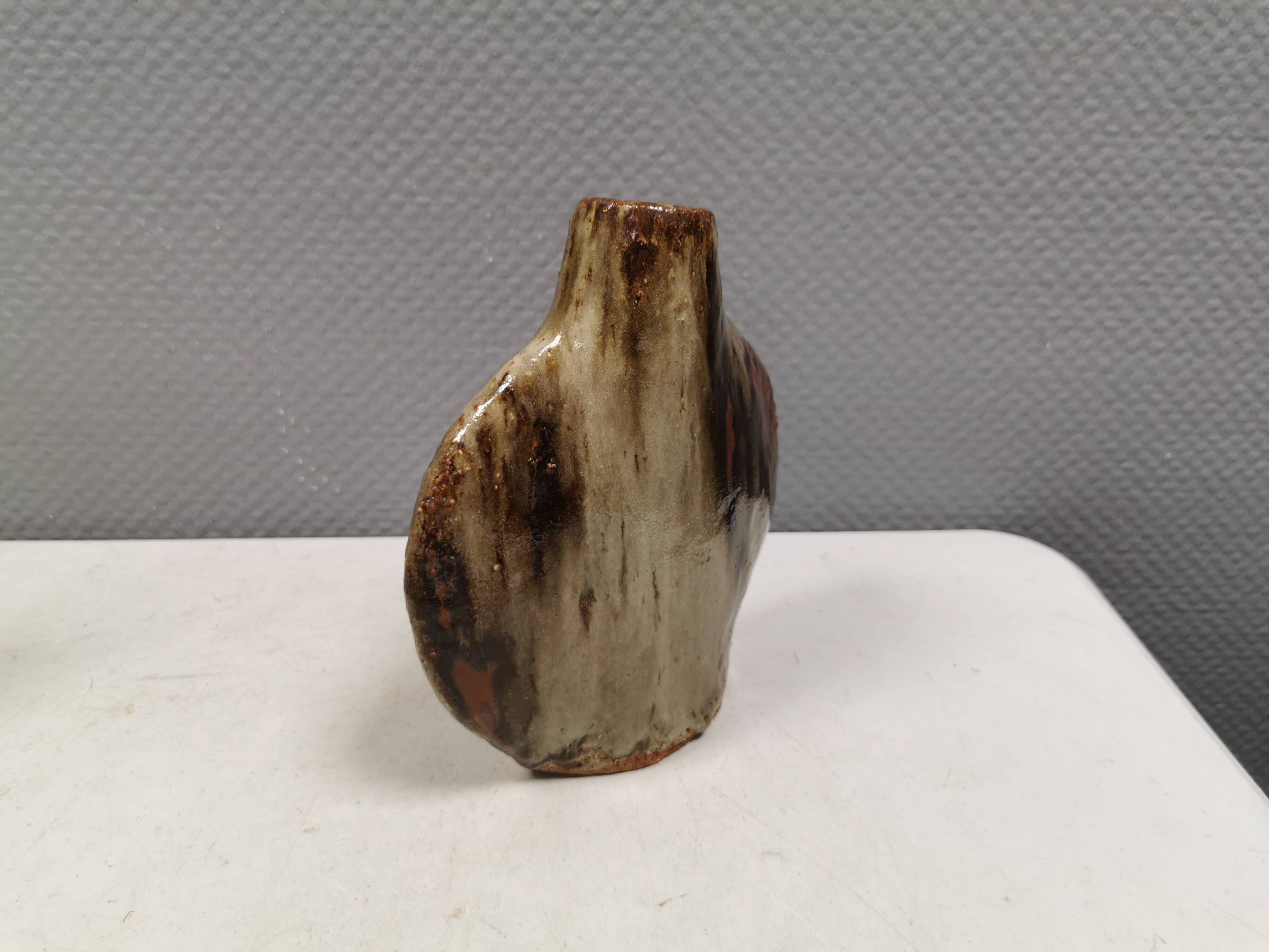 A beautiful Brutalist vase in lovely earth tones. Danish, from the 1980s.