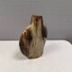 A beautiful Brutalist vase in lovely earth tones. Danish, from the 1980s.