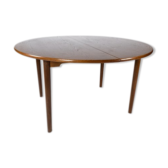 Dining table in dark oak of danish design from the 1960s.