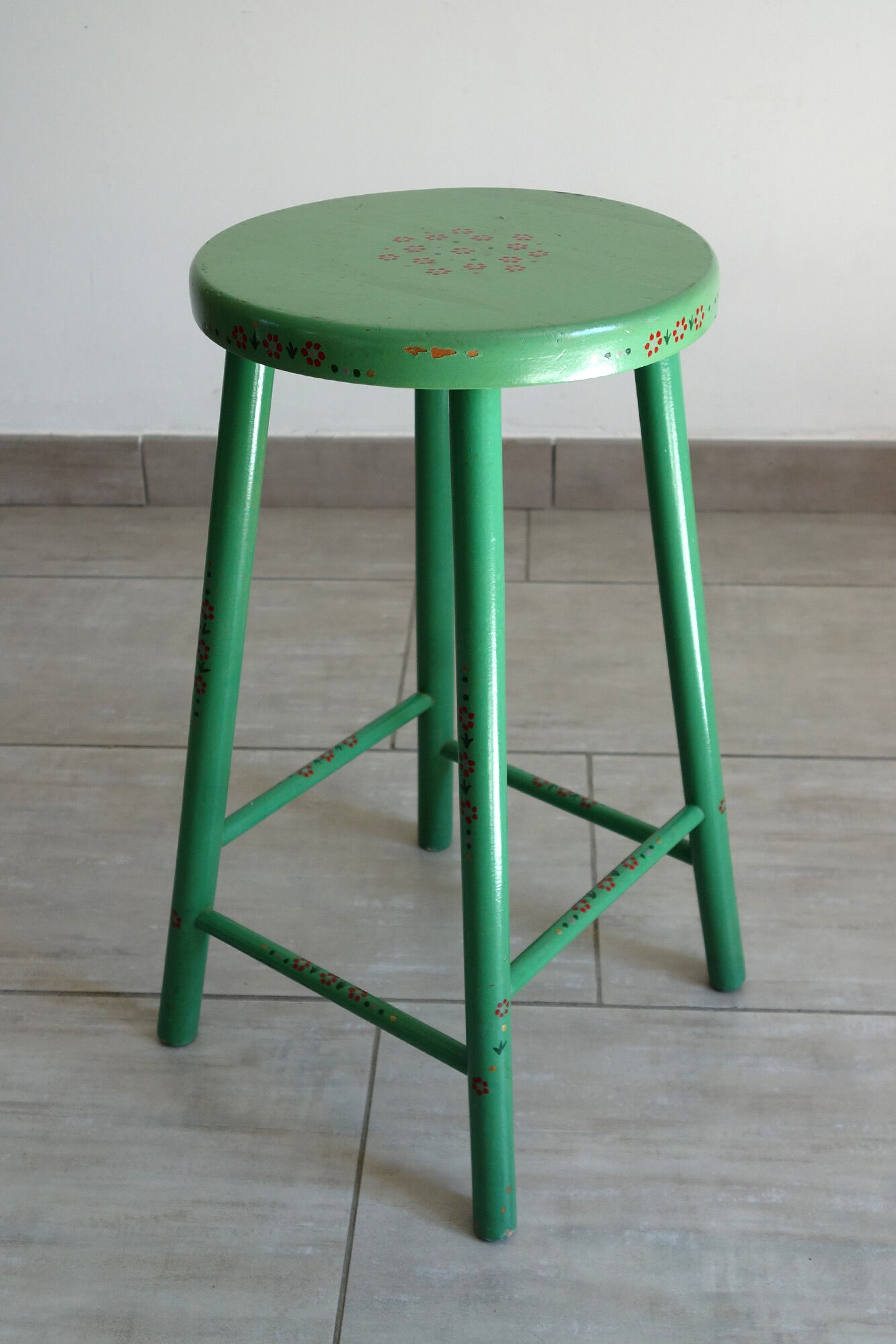Old painted and decorated wooden stool