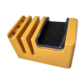 Pencil holder rests phone with waiting music, vintage 70s