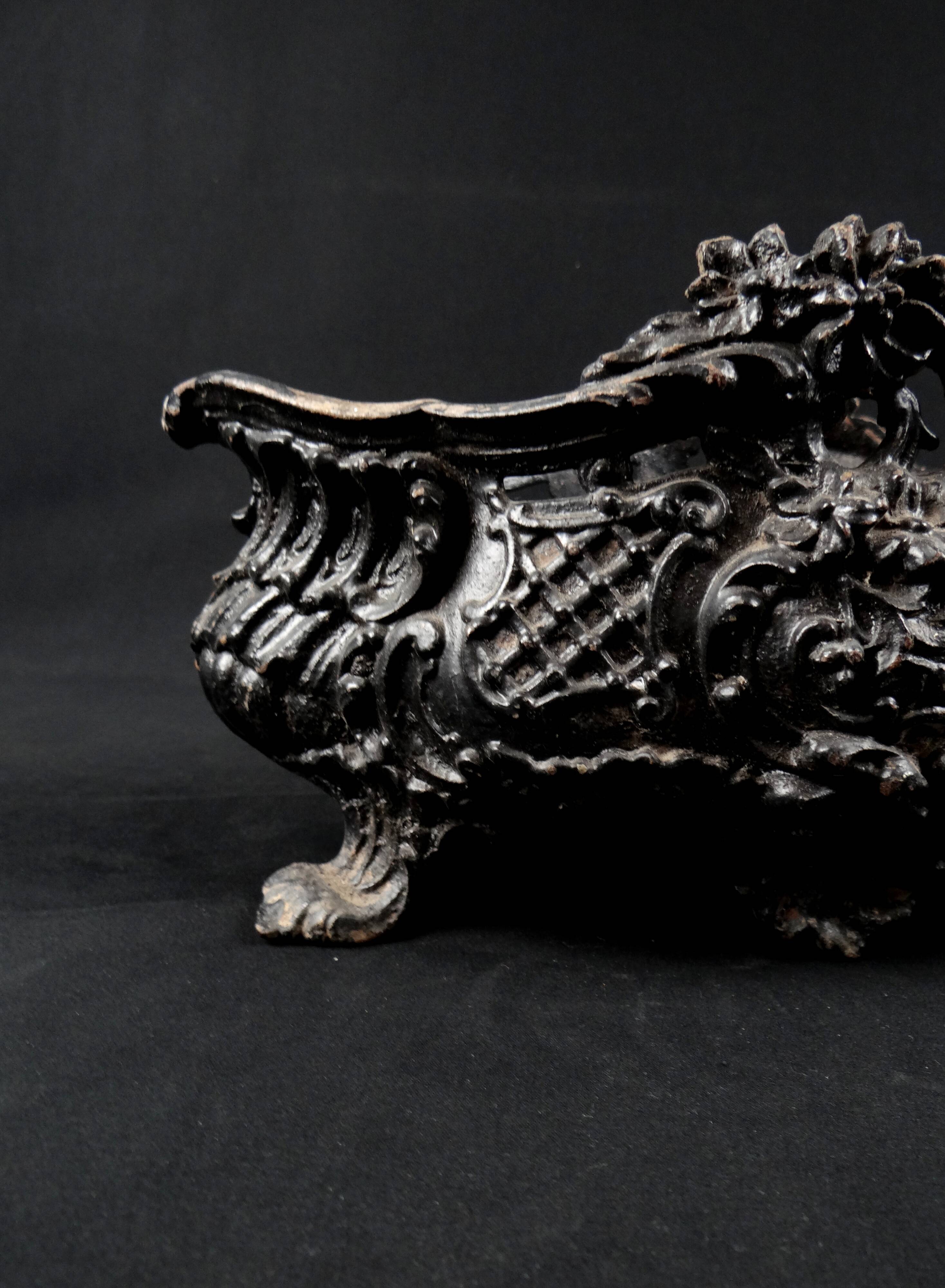 Antique black cast iron planter from the late 19th century Rocaille style