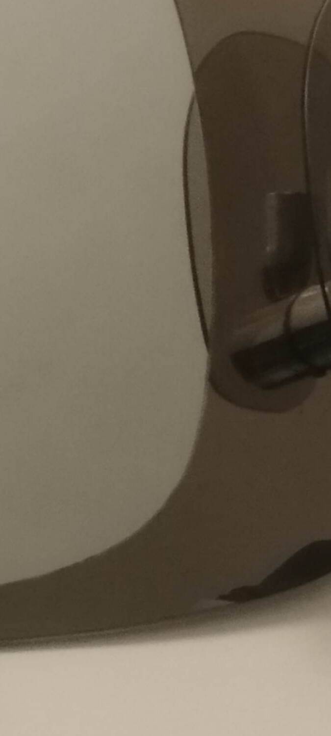 Miroir avec deux appliques en verre fumé attribué à Lupi