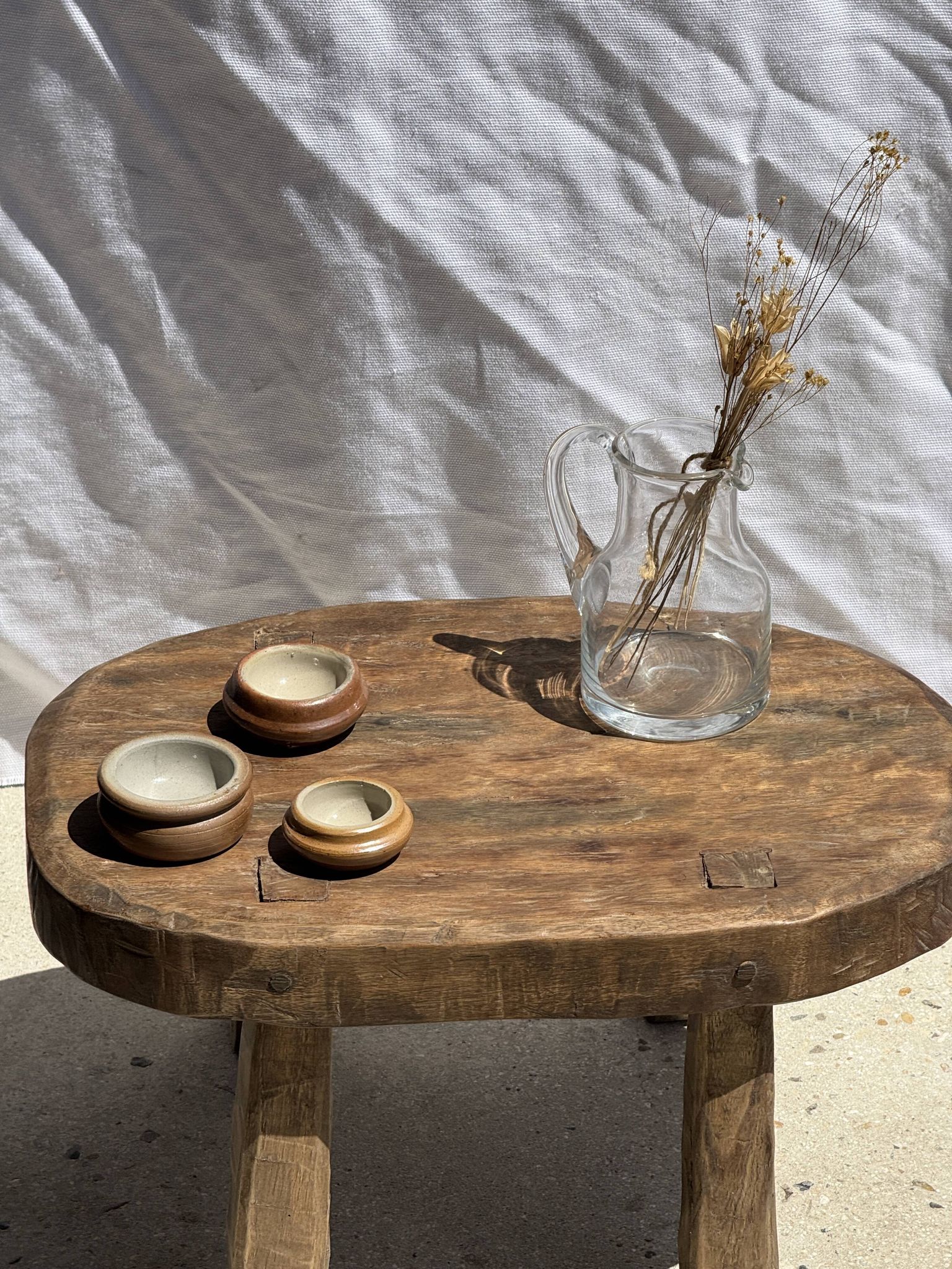 Small stool, oval solid teak accent stool with a two-tone seat.