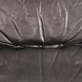 Armchair and footstool by André Vandenbeuck for Strässle in black leather