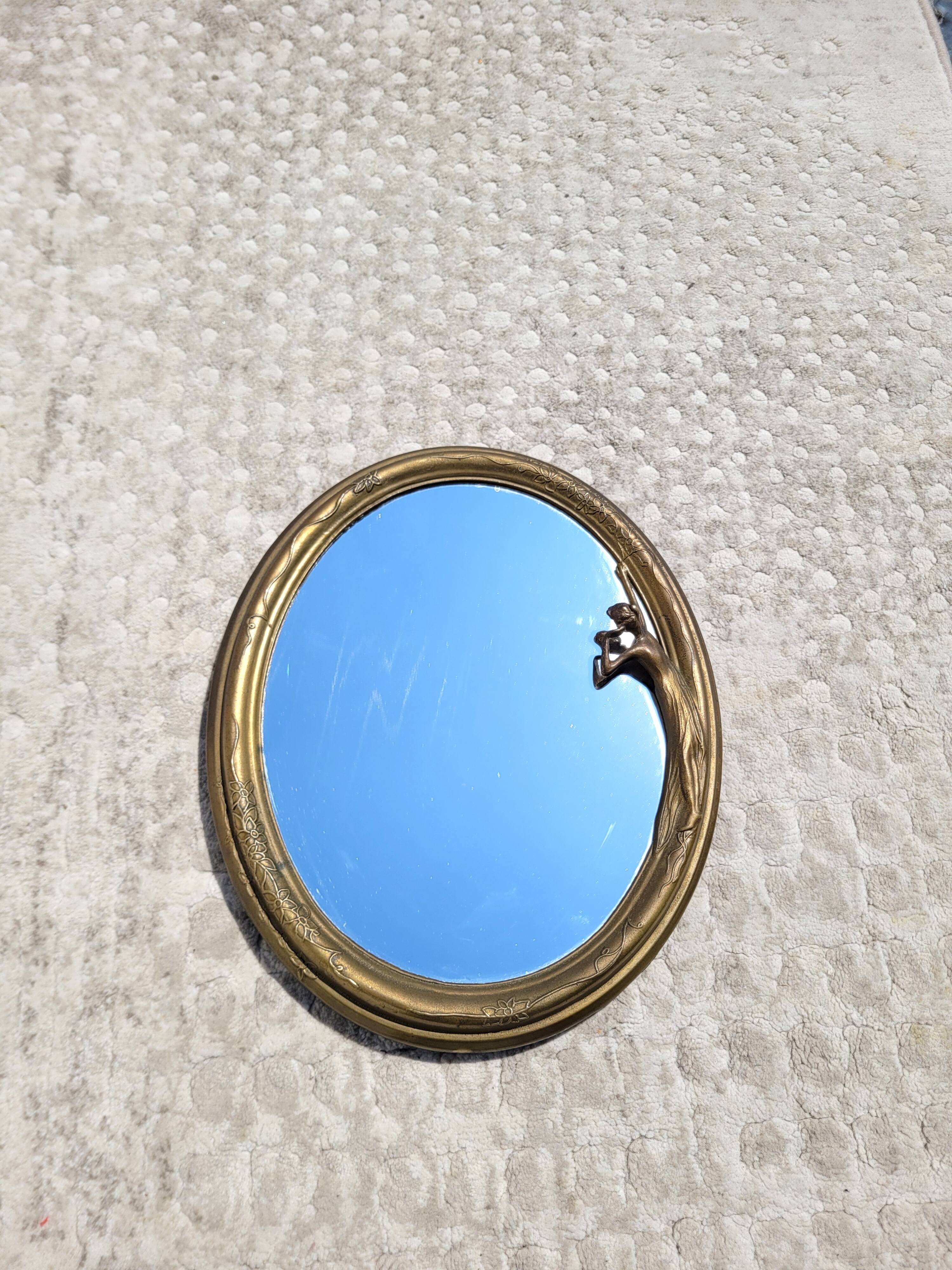 Oval mirror in gilded brass, Belle Époque style