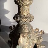 Large bronze candlestick with tripod and winged dog decoration, 19th century.